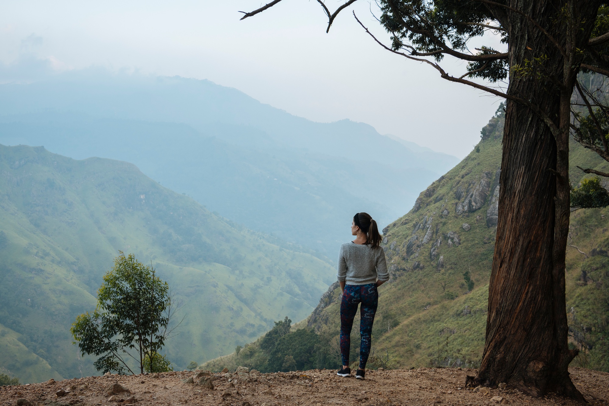 Woman enjoying view on hilltop, Ella, Uva, Sri Lanka